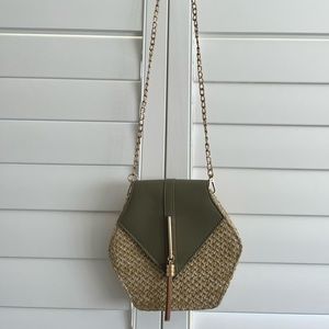 Cross body bag with flap. Seafoam color with natural woven material.